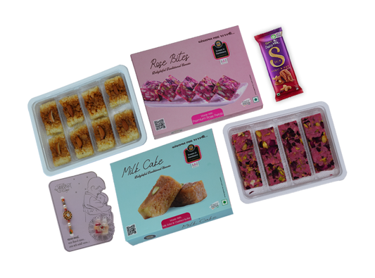 Assorted packaged snacks including cookies, cake, and bars on a white background